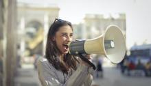 Photo by Andrea Piacquadio: https://www.pexels.com/photo/cheerful-young-woman-screaming-into-megaphone-3761509/